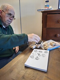 Dad working with stamps and ink