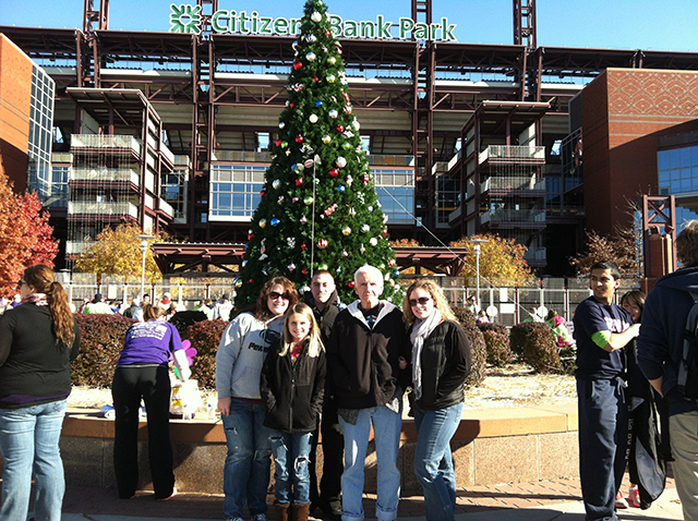 family photo in front of a Christmas tree