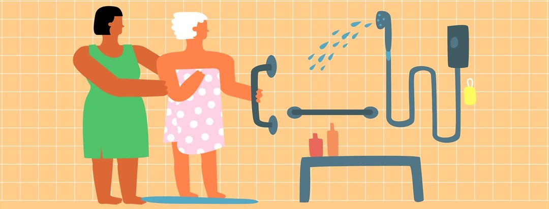 An older woman in a towel is helped into a shower with many assistive devices like bars and handles and a bench by a younger woman wearing a dress.