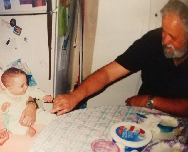 Amy's dad tickling his granddaughter