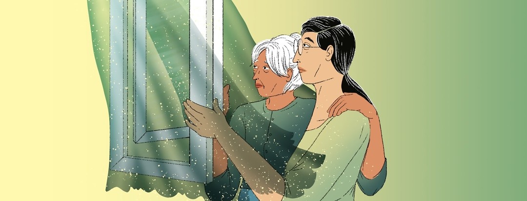 An older woman with her arm around a younger woman look out an open window. The curtains blow around them from the breeze.