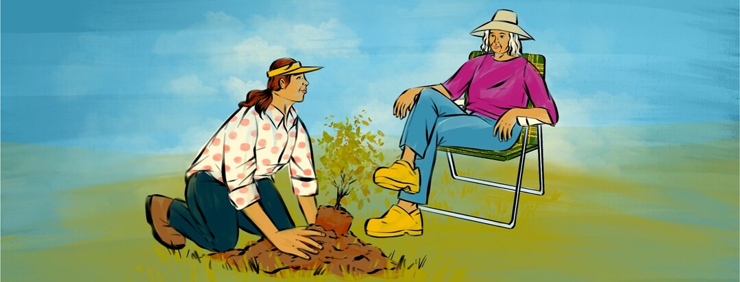 alt=A younger woman kneels on the ground, planting a tree. She smiles up an an older woman smiling and sitting in a lawn chair.