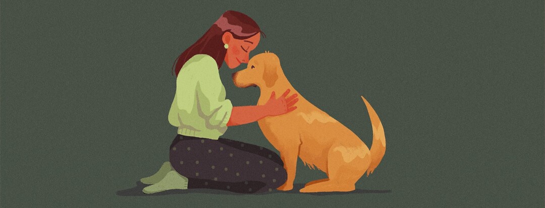 alt=A woman and a dog snuggle