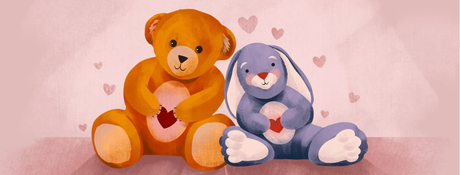 alt=a teddy bear and stuffed rabbit smile & hold hearts. Hearts float around them.
