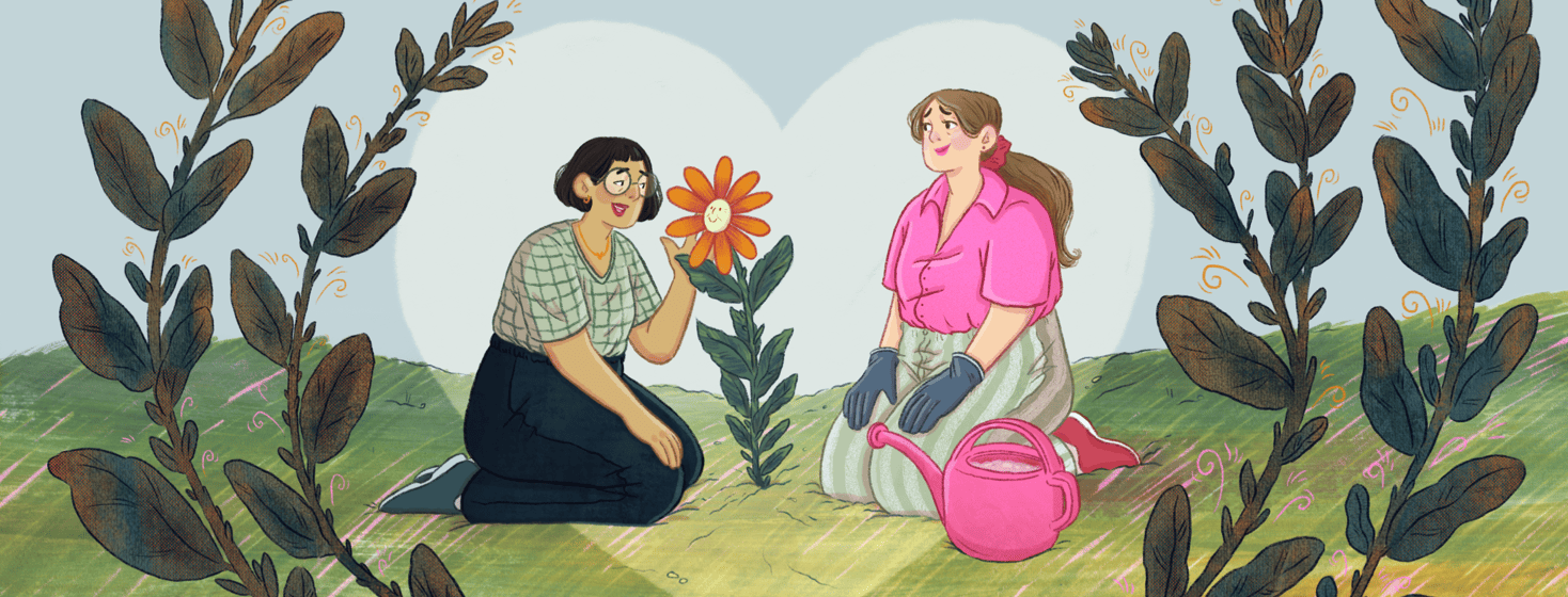 Two people are on their knees in a garden, one is wearing gardening gloves and has a watering can next to them, the other is talking to the flower between them which has a smiling face.