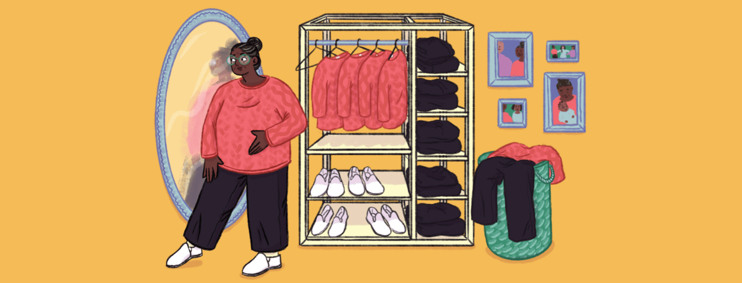 A woman wearing a pink sweater, black pants, and white slip on shoes is looking at herself in the mirror; behind her there is a wardrobe and laundry basket with multiples of the same pink sweater, black pants, and slip on shoes; photos on the wall show her in the same outfit